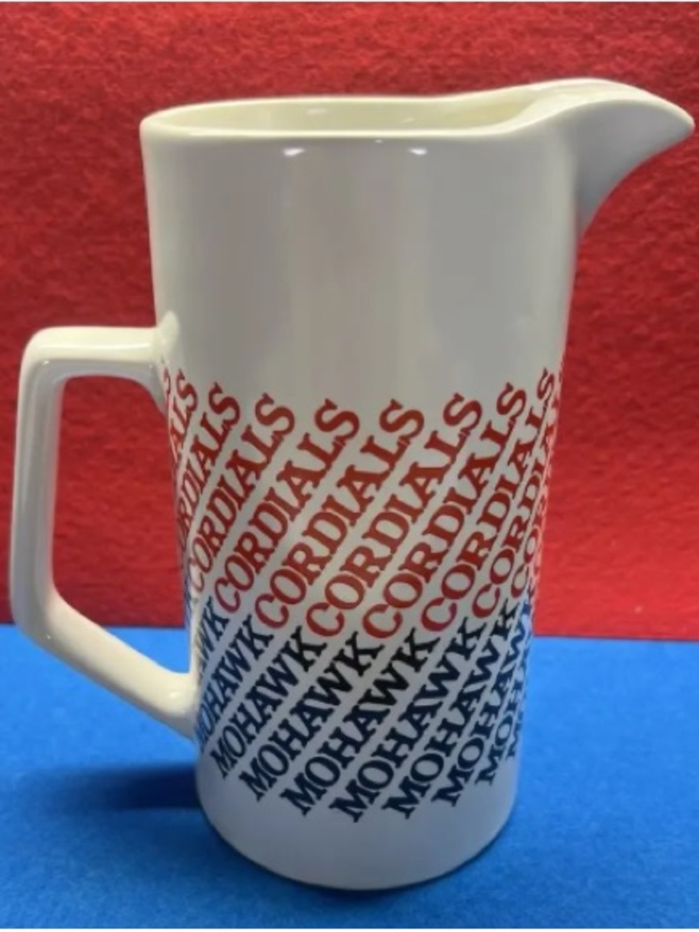 Mohawk Cordials White Ceramic Pitcher with Red and Blue Text